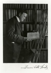 Old portrait of Francis Carter Wood in a study or library.